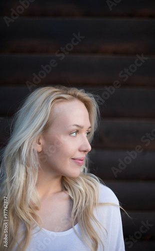 Wallpaper Mural Attractive woman standing in front the rustic wooden door Torontodigital.ca