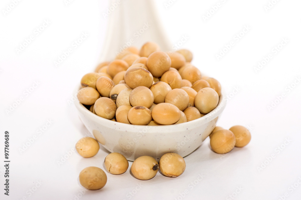 Soybeans on spoon with white isolated background Soybeans on spoon with white isolated background