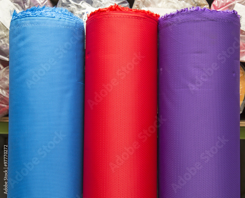  material woven fabric rolls in warehouse and manufacturing industry.