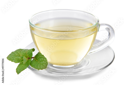 Glass cup of tea with mint leaves isolated on white background