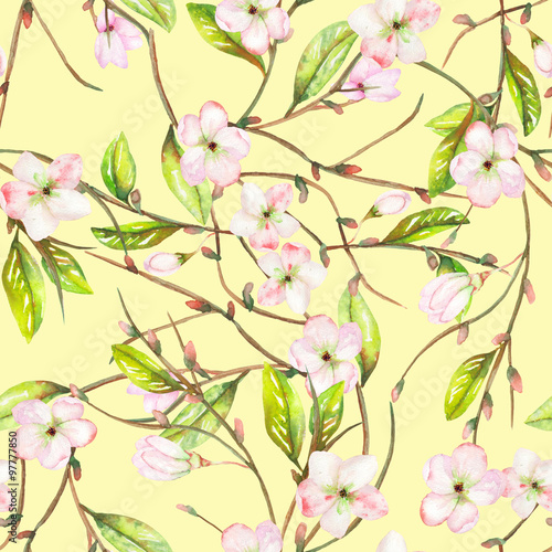 A seamless floral pattern with an ornament of an apple tree branch with the tender pink blooming flowers and green leaves, painted in a watercolor on a yellow background