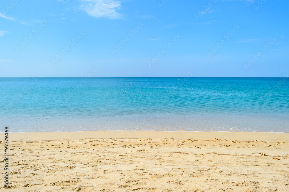 White sand and clear water sea with blue sky at Naiyang beach in Phuket Thailand 