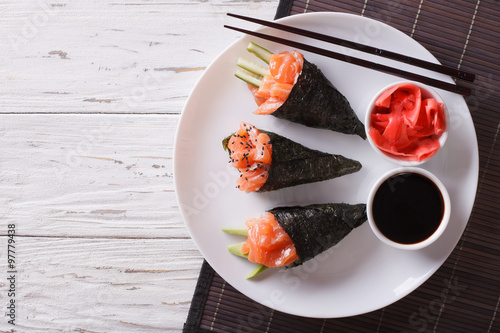 Japanese food: Salmon temaki, ginger and sauce. Horizontal top view
