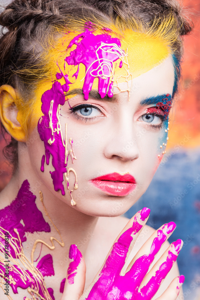 Obraz Portrait of beautiful young woman with paint on face