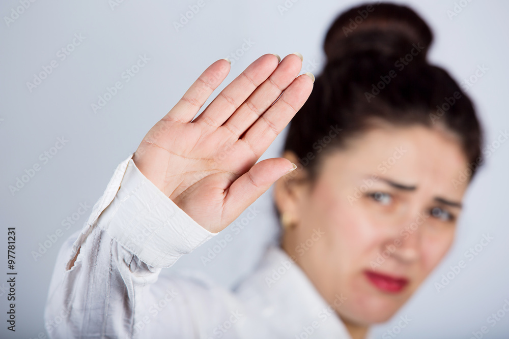 No More Concept,Stop Gesture.Portrait of a young woman with raised hand making No more gesture.No more Unhealthy food,No more smoking,Alcohol. No More Concept,Stop Gesture.Portrait of a young woman with raised hand making No more gesture.No more Unhealthy food,No more smoking,Alcohol.