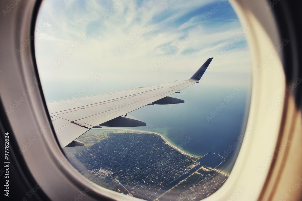 Looking through window aircraft, landing to Copenhagen airport Kastrup. Looking through window aircraft, landing to Copenhagen airport Kastrup.
