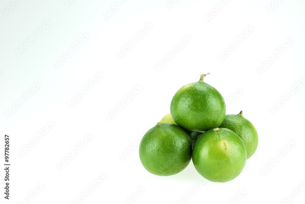 Green lemons isolated on white background
