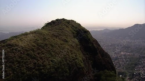 Flying above the hill to reveal the city, Rio De Janeiro, Brazil photo