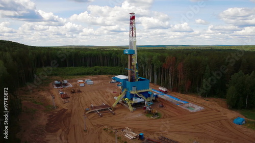 the oil gas drilling tower in forest