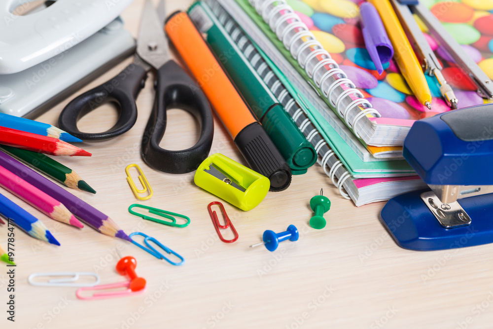 Group of school supplies and books over a white background Group of school supplies and books over a white background