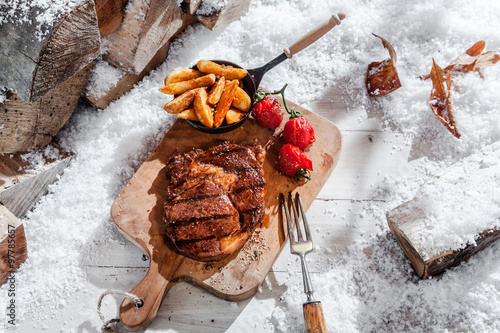 Marinated grilled rib-eye steak and vegetables photo