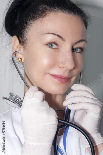 Beautiful doctor with her stethoscope photo