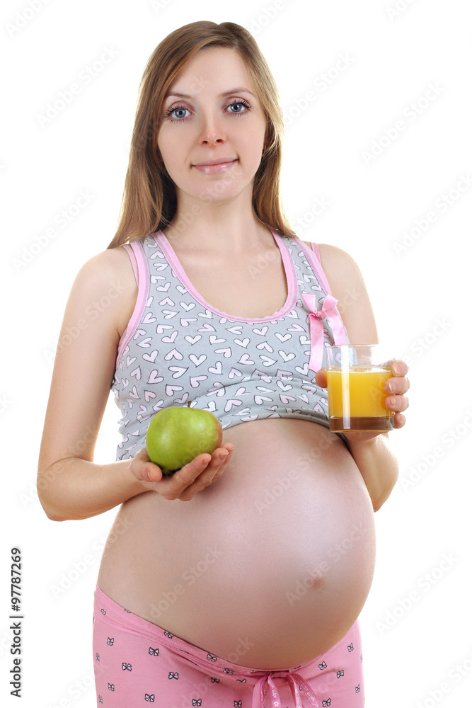 a pregnant woman in pyjamas, holding a green Apple and a Cup of Apple juice isolated on white background a pregnant woman in pyjamas, holding a green Apple and a Cup of Apple juice isolated on white background