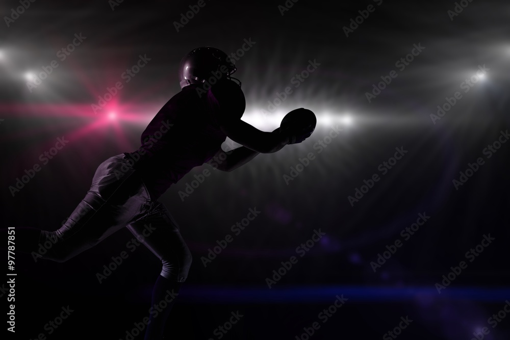 Composite image of silhouette american football player 