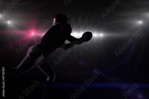 Composite image of silhouette american football player  © vectorfusionart