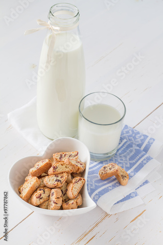 Milk and cookies on white background