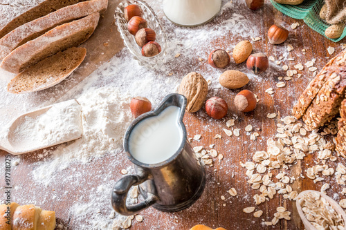 at the bakery, still life with mini Croissants, bread, milk, nuts and flour © eyalg_115