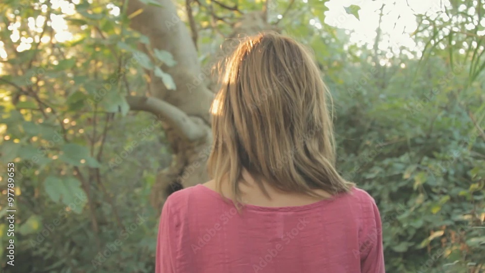 Girl walking in a jungle-like environment. Girl walking in a jungle-like environment.