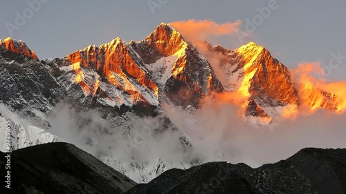 golden snow mountain sunset in the Himalayas photo