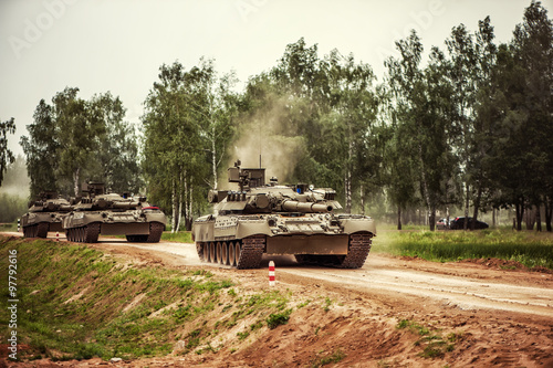 russian tanks driving on a country road