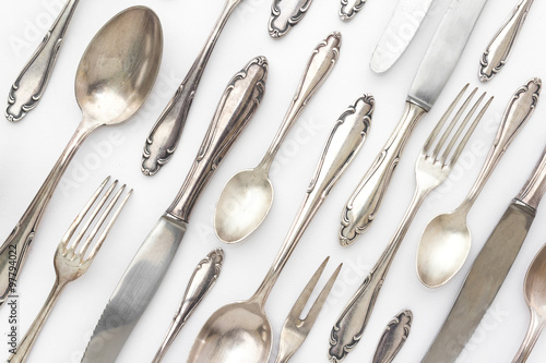 fancy silver cutlery set on white background - old sterling flatware set / pattern