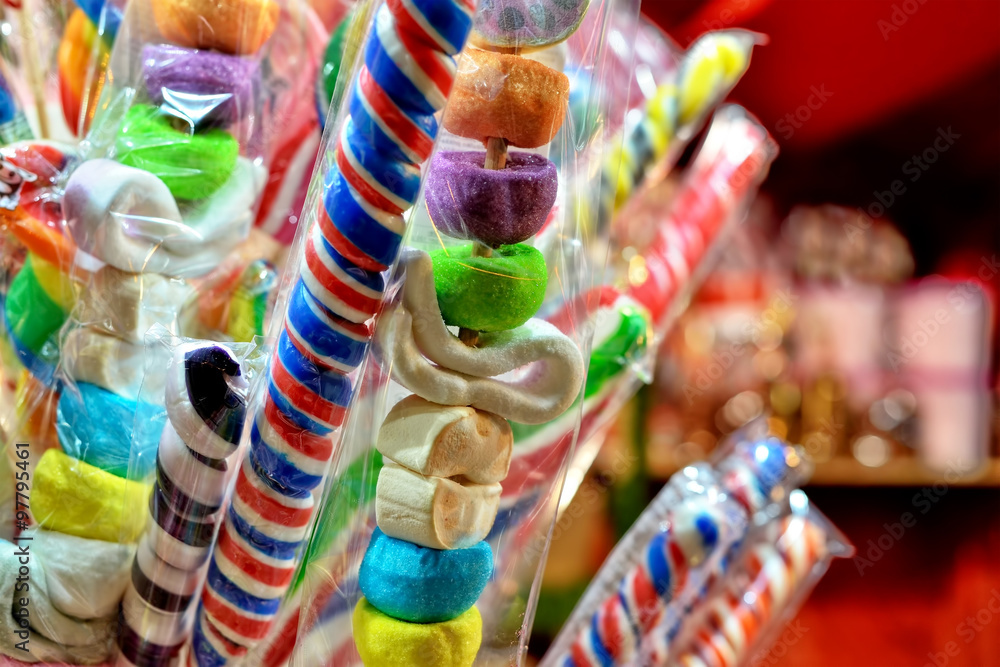 Assorted candies on outdoor shop bar