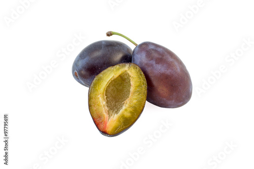 Fresh blue plums isolated on a white background. Fruits series.