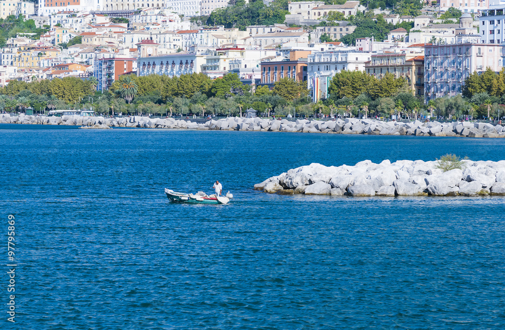 Obraz premium Fishing boat leaving the sea port of Salerno, Salerno, Italy.