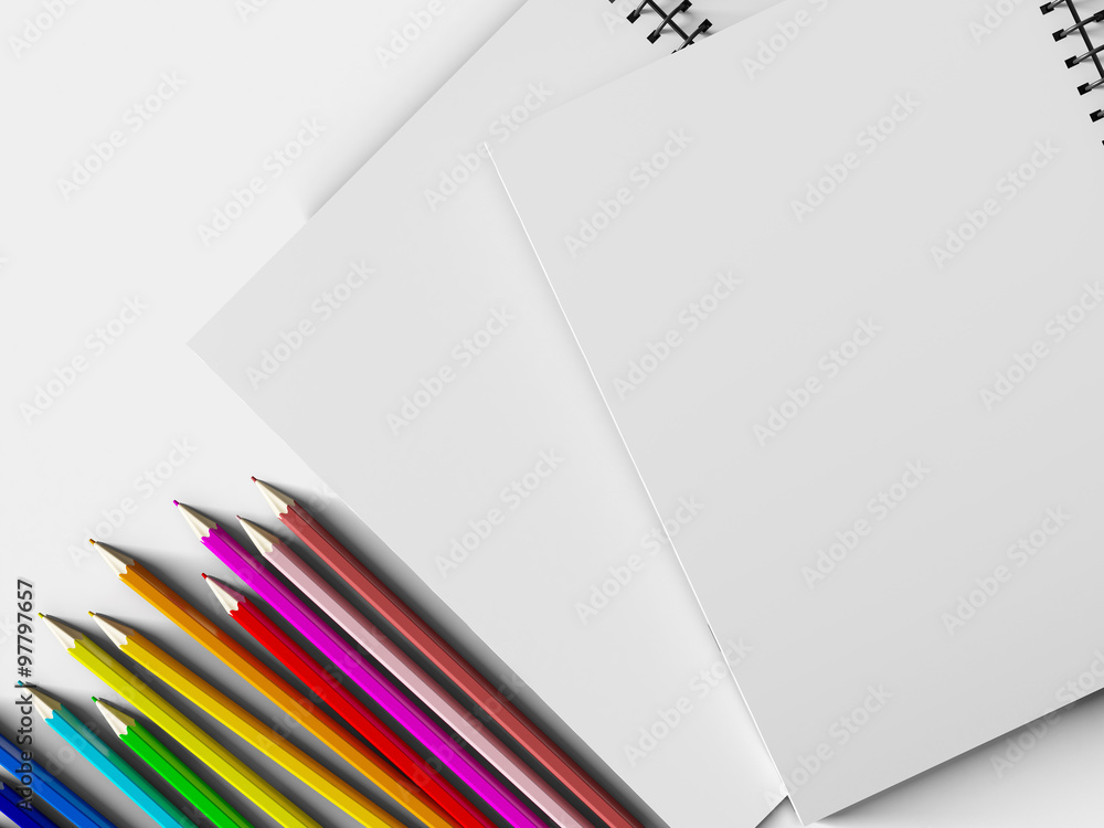 Fototapeta premium notebook with colored pencils on White background