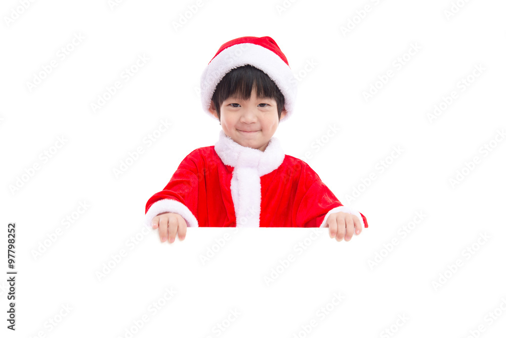 Little asian boy in Santa Claus uniform with an empty banner Little asian boy in Santa Claus uniform with an empty banner