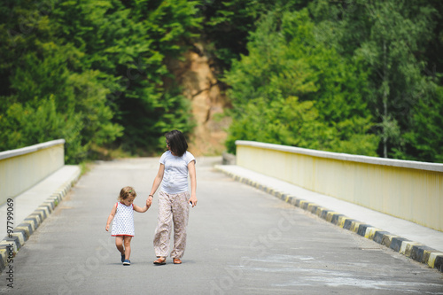 Woman and Girl on Bridge
