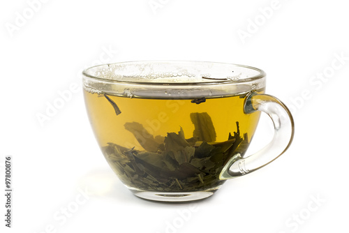 Glass cup of green tea isolated on white