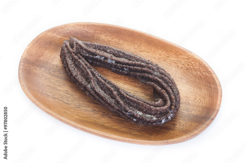 Chocolate donut in wooden plate on white background Chocolate donut in wooden plate on white background