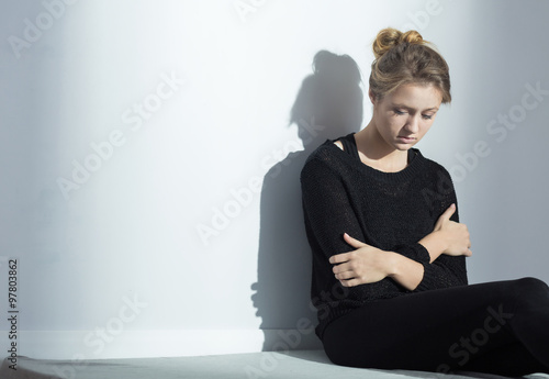 Lonely woman with anorexia nervosa photo