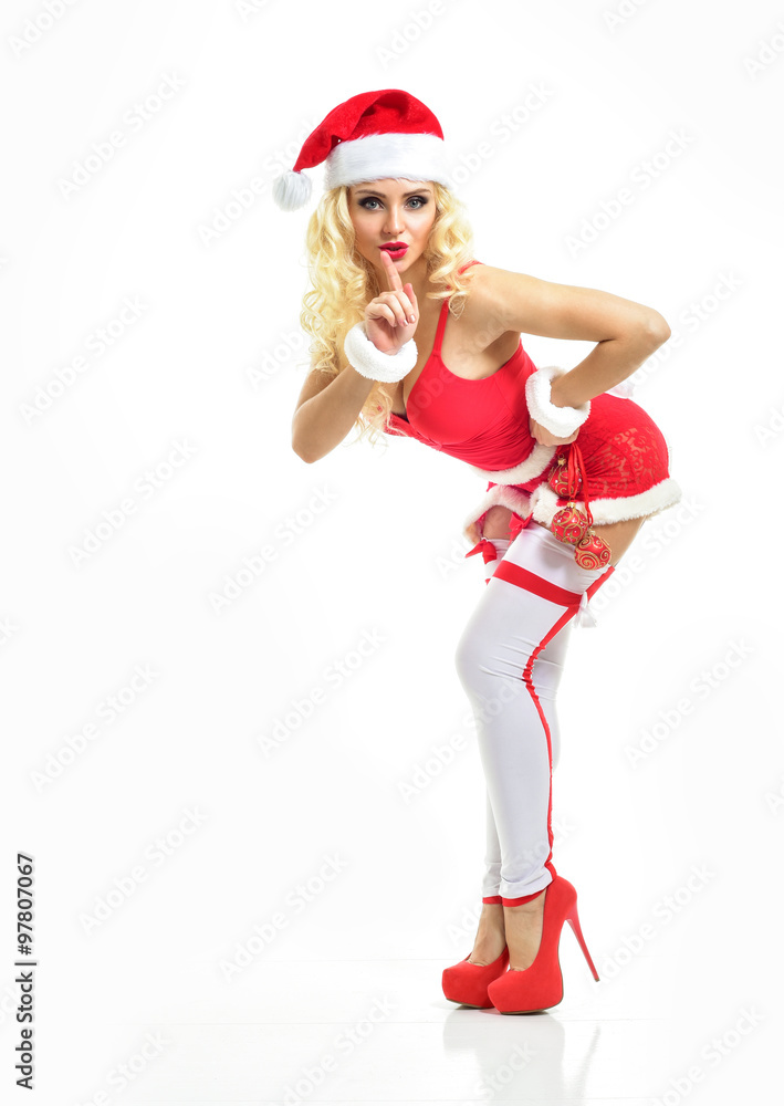 Obraz premium Beautiful sexy girl wearing santa claus clothes. Christmas Woman