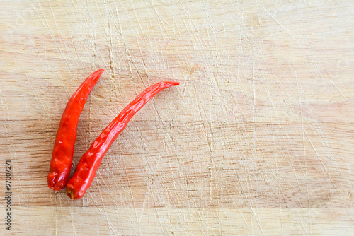 Red pepper on the wooden floor