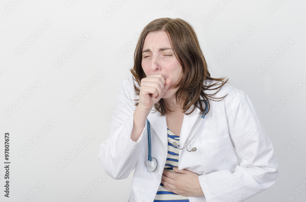 Female doctor sneezing. Female doctor sneezing.