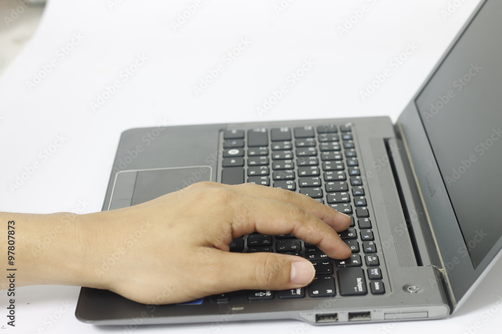Female hand typing on computer keyboard Female hand typing on computer keyboard