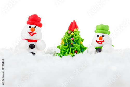 Sweet dessert snowman, snow and Christmas tree with festive decoration