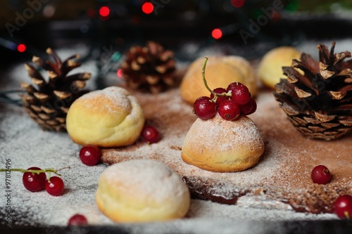 Homemade Christmas cakes and red currant berries.