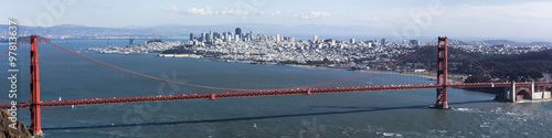 Golden Gate bridge seen from Marin County, with view of San Francisco across the bay on a clear winter's day.