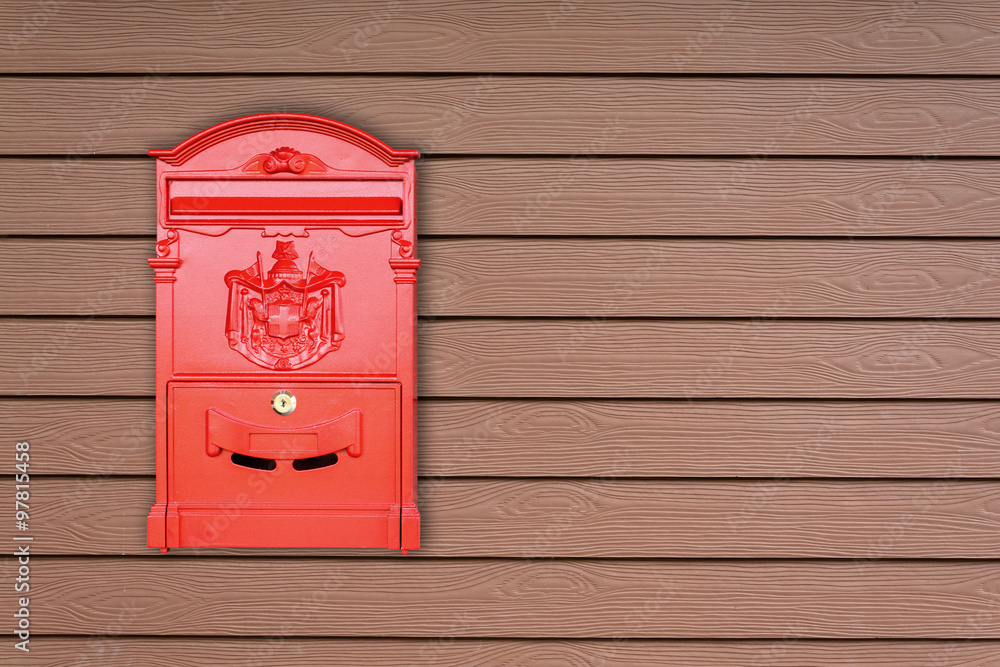 Red mailbox with wooden background with copy space Red mailbox with wooden background with copy space