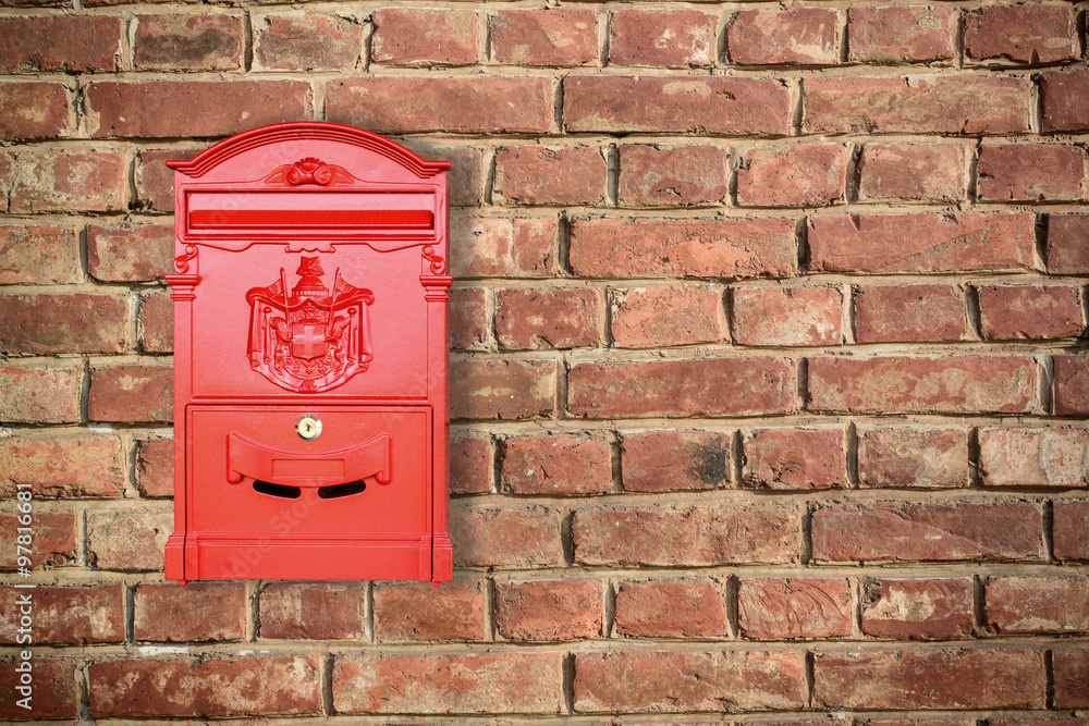 Red mailbox with old brick wall background with copy space Red mailbox with old brick wall background with copy space