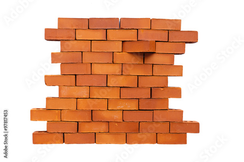 brick in the wall shifted. brick wall in the stage of destruction. one of the bricks moved from its place. Isolated on white background. concept stand out from the crowd, be different from other