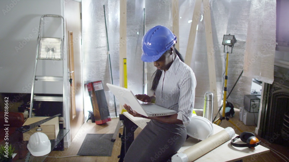 Confident female engineer or architect working at construction site. Shot on RED Epic. Confident female engineer or architect working at construction site. Shot on RED Epic.