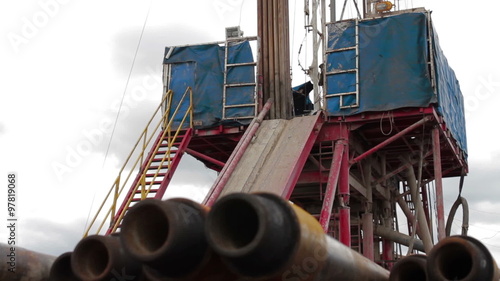 Horizontal slide shot of drilling rig photo