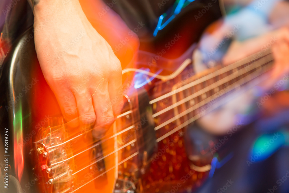 Obraz premium aggressive play guitar on stage