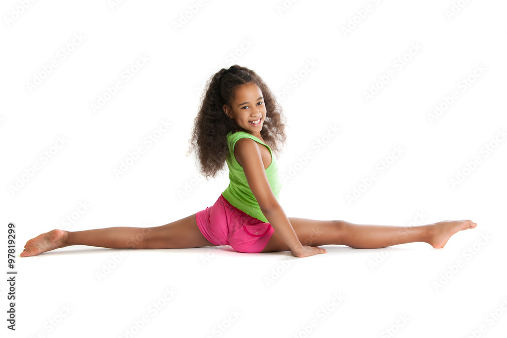 Joyful dark-skinned girl sitting on the splits Joyful dark-skinned girl sitting on the splits