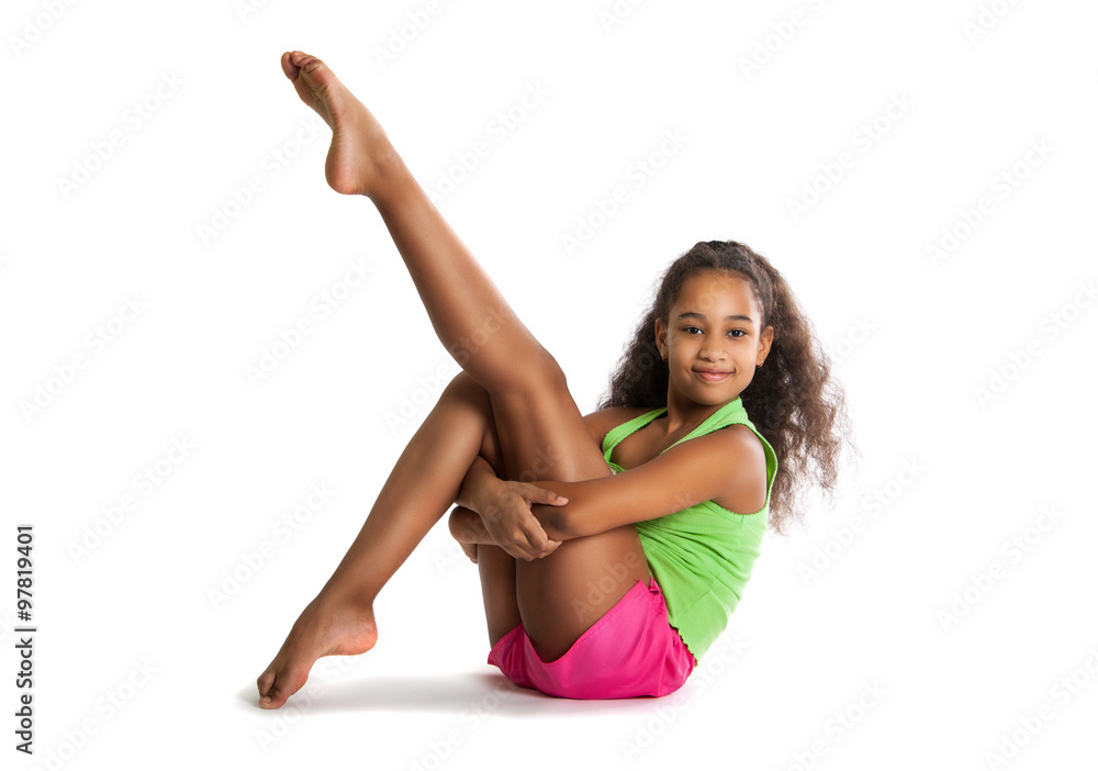 little girl gymnast doing exercises. Cheerful child aerobics little girl gymnast doing exercises. Cheerful child aerobics