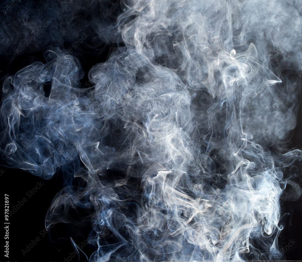 Obraz premium Smoke fragments on a black background